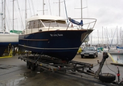 An ACM-Heritage motor boat being delivered from Gosport boat yard to Thames Ditton boat yard on the river Thames in London