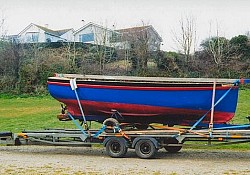 A cornish crabber loaded in Goran Haven, Cornwall with its own launch trolley to be transported to Loch Long, Scotland