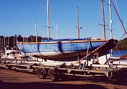 A classic Folk Boat built by TOFINOU loaded near Dartmouth for transport to Portsmouth